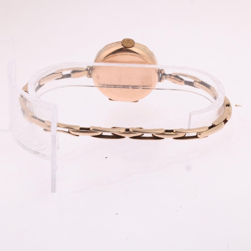 1024 - A 9ct gold mechanical bracelet watch, circa 1920, white enamel dial with black and red Arabic numera... 