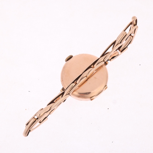 1024 - A 9ct gold mechanical bracelet watch, circa 1920, white enamel dial with black and red Arabic numera... 