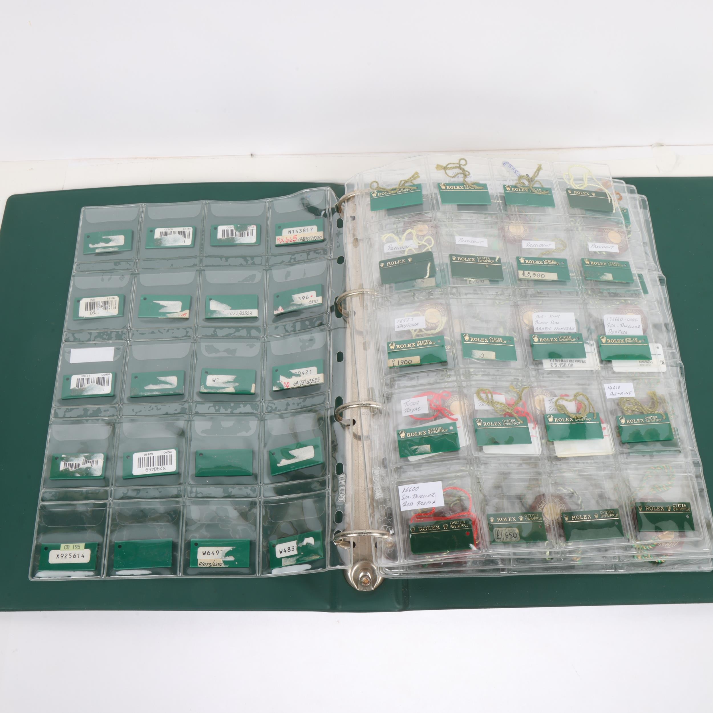 ROLEX - a folder of watch sales tags and chronometer tags