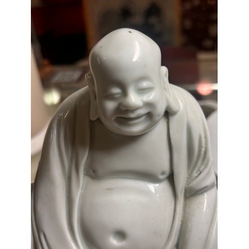 365 - A Chinese blanc de chine porcelain figure of Budai, on original fitted wood stand, height 14.5cm