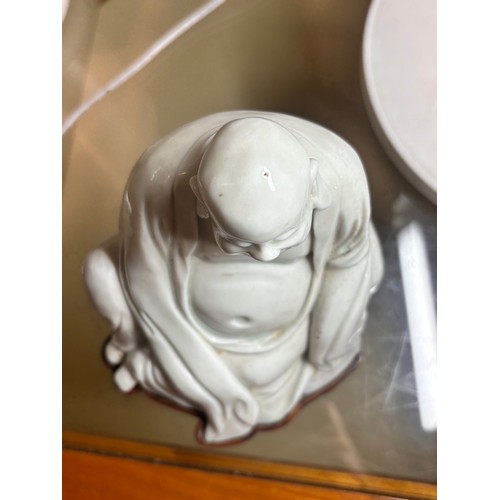 365 - A Chinese blanc de chine porcelain figure of Budai, on original fitted wood stand, height 14.5cm