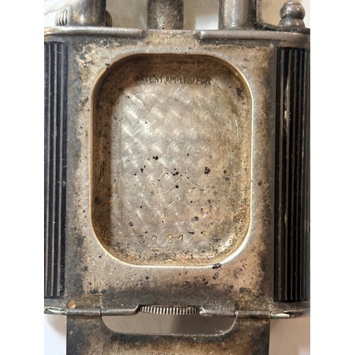 1030 - DUNHILL - an Art Deco silver and black enamel combination pocket lighter and watch, circa 1930, roun... 