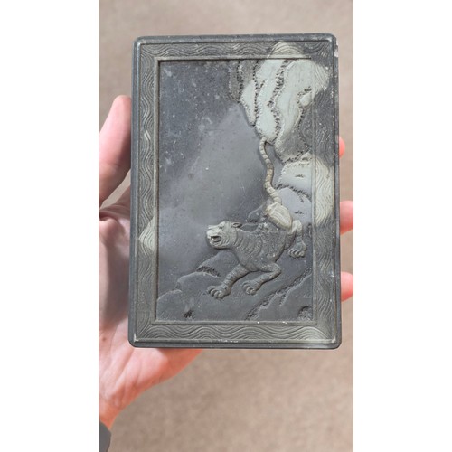 364 - A Chinese inkstone box and cover, with tiger design relief carved lid, 15cm x 10cm, and a carved soa... 