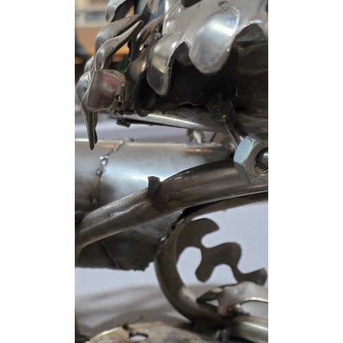 136 - LEIGH DYER (born 1959) - a spectacular handmade stainless steel wall mount, designed to hold a diver... 