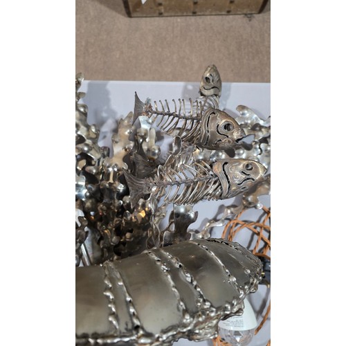 136 - LEIGH DYER (born 1959) - a spectacular handmade stainless steel wall mount, designed to hold a diver... 