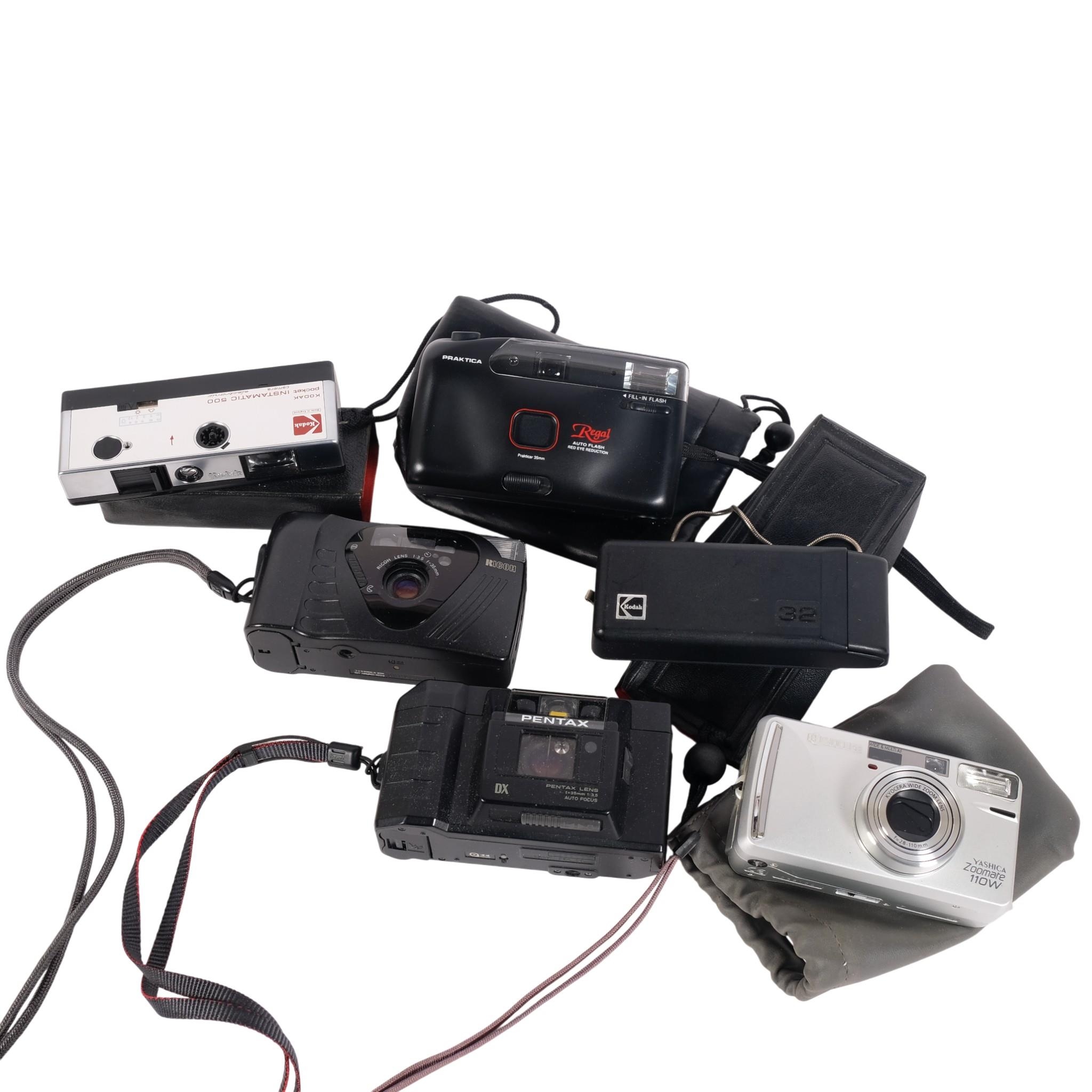 A group of Instamatic cameras, including a Praktica Regal, a Kodak ...
