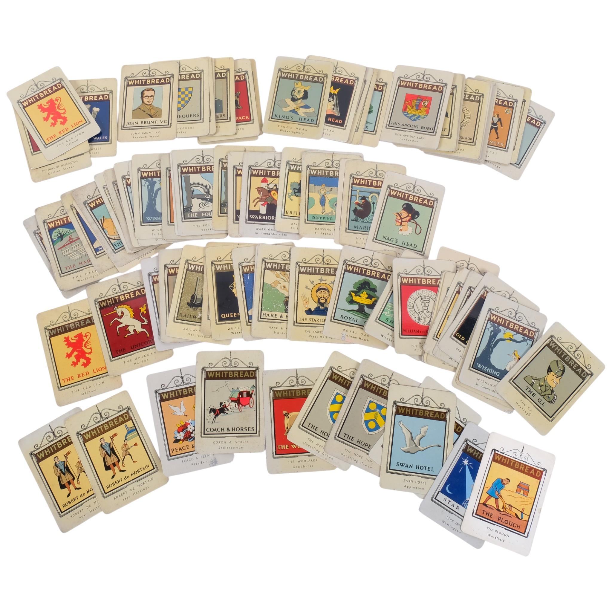 A collection of Whitbread miniature metal Inn signs, including a ...