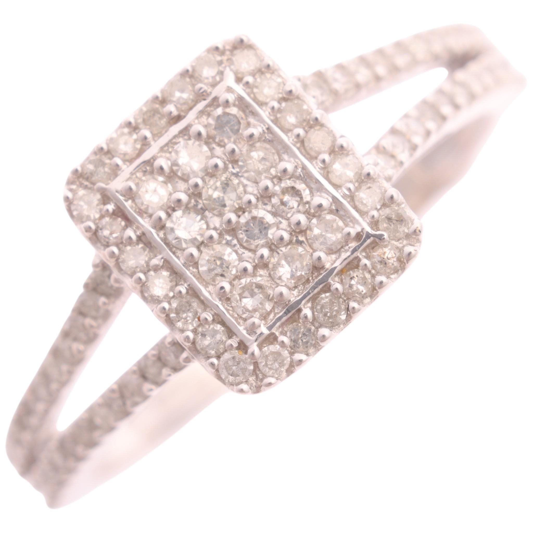 A 9ct white gold diamond cluster panel ring, by TJC, pave set with ...