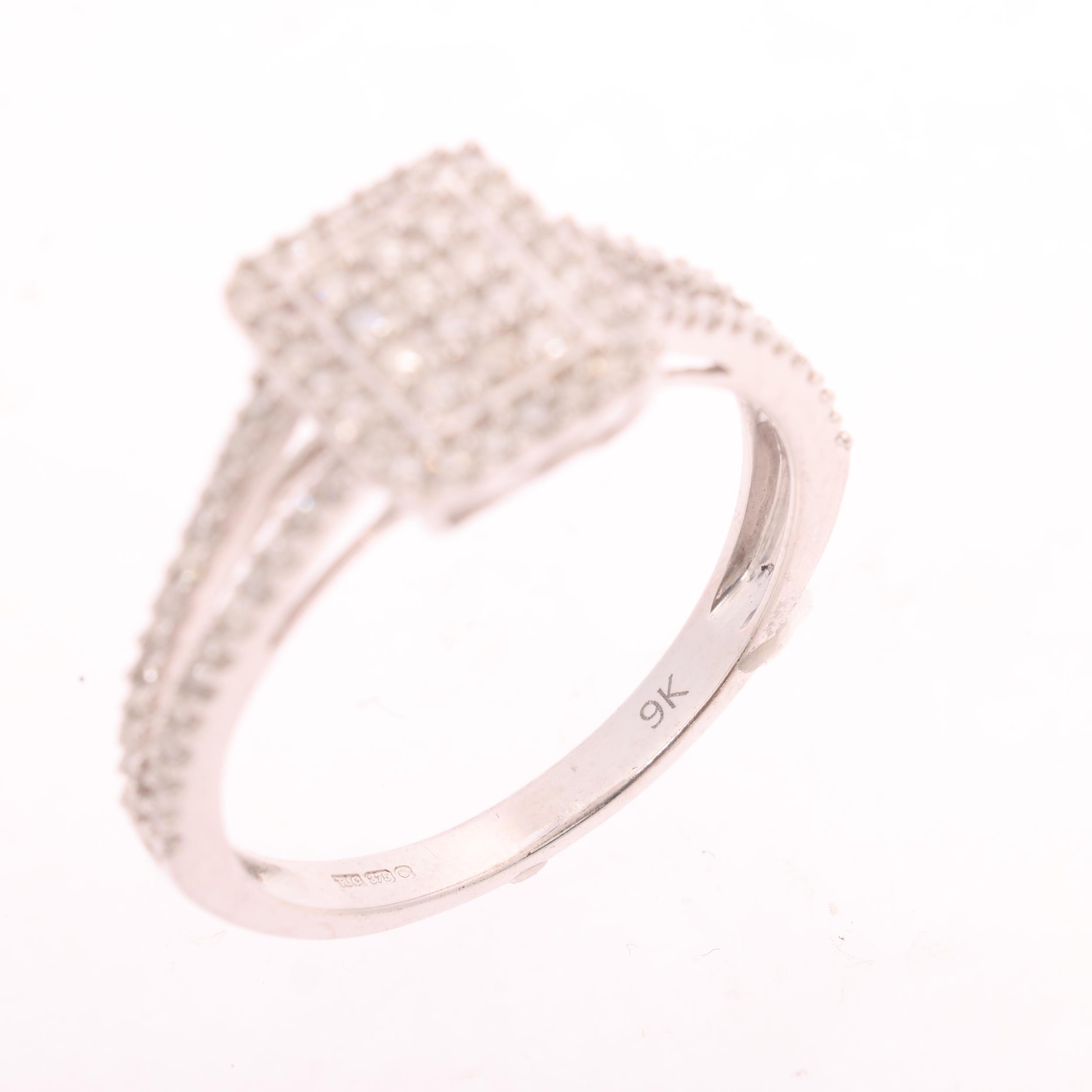 A 9ct white gold diamond cluster panel ring, by TJC, pave set with ...
