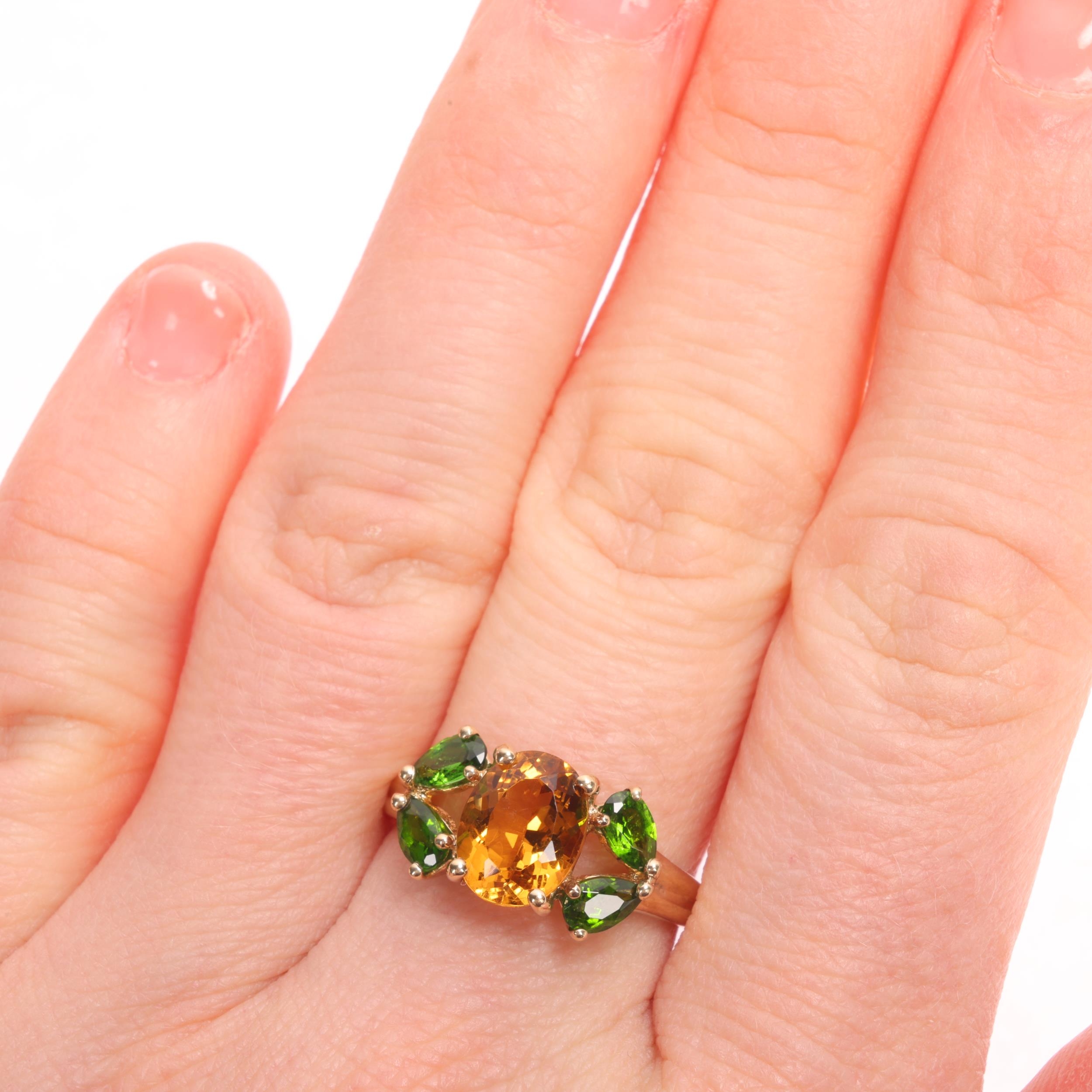 A 9ct gold citrine and peridot ring, QVC, setting height 9.4mm, size O ...