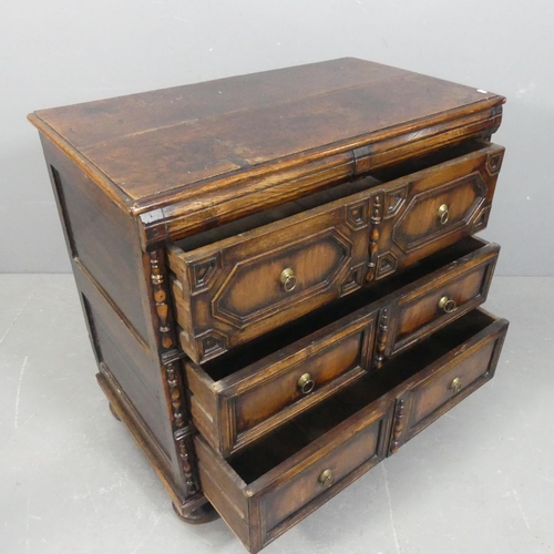 An antique Jacobean style oak chest of three long drawer, with carved ...