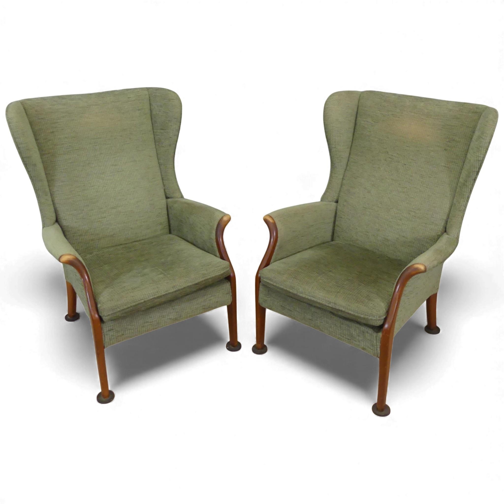 A pair of Parker Knoll PK750 armchairs, in original green upholstery ...
