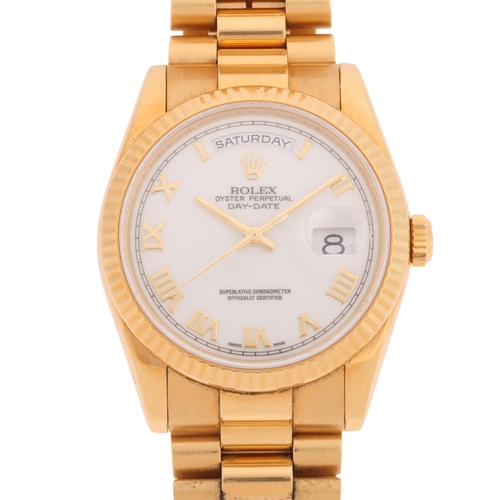 ROLEX - an 18ct gold Oyster Perpetual Day-Date automatic calendar bracelet watch, ref. 118238, circa 2000, white dial with applied gilt Roman numeral hour markers, dauphine baton hands, sweep centre seconds hand, day aperture at 12 o'clock, cyclops date aperture at 3 o'clock, fluted bezel and 18ct gold Rolex President link bracelet, 31 jewel movement with calibre 3155, serial no. P623411, case width 36mm, 168.3g gross, working order, boxed with Goeres of Luxembourg valuation dated 2011