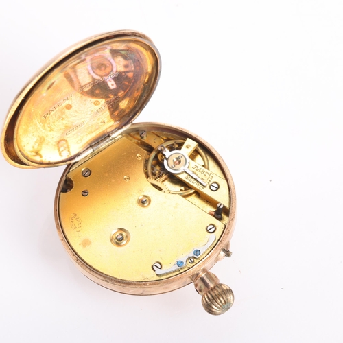 1051 - An early 20th century 9ct rose gold open-face keyless fob watch, gilt chased dial with black Roman n... 