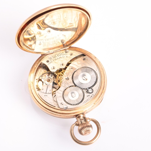 1053 - WALTHAM - an early 20th century 9ct rose gold open-face keyless pocket watch, white enamel dial with... 