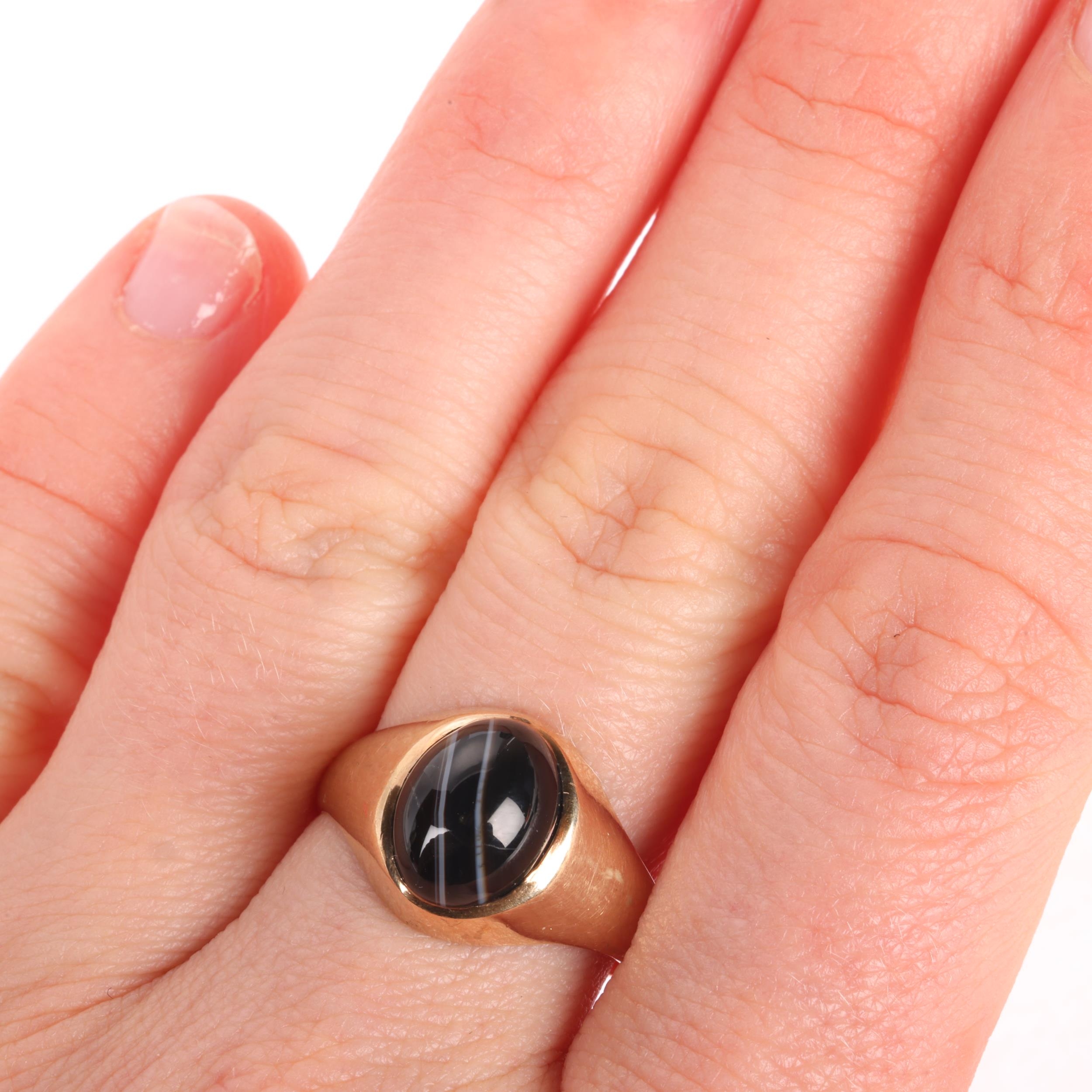 A 9ct gold banded agate signet ring, maker CS, London 1975, set with ...