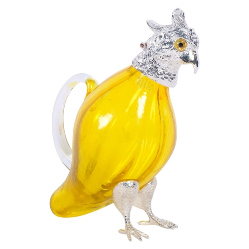 264 - A modern novelty yellow glass decanter with silver plated mounts in the form of a parrot, standing H... 