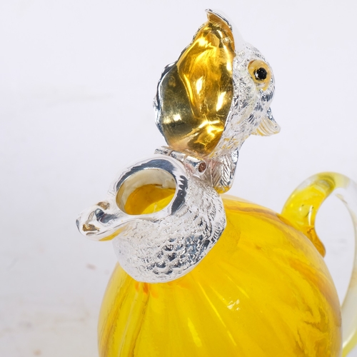 264 - A modern novelty yellow glass decanter with silver plated mounts in the form of a parrot, standing H... 