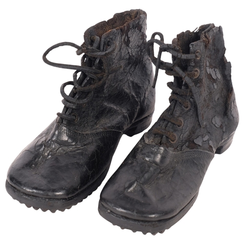 276 - A pair of Georgian leather boots, possible an apprentice,  with metal studded soles,
