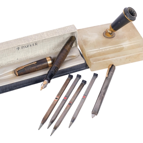285 - A Parker 14ct nibbed Vacuumatic fountain pen, a silver-cased letter opening retractable knife, and a... 