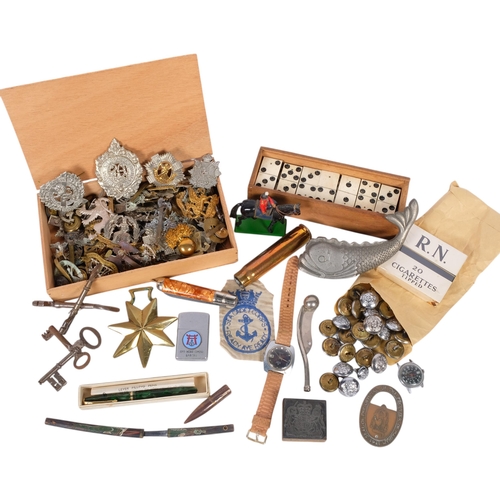 287 - A collection of various military cap badges and buttons, along with a number of other miscellaneous ... 