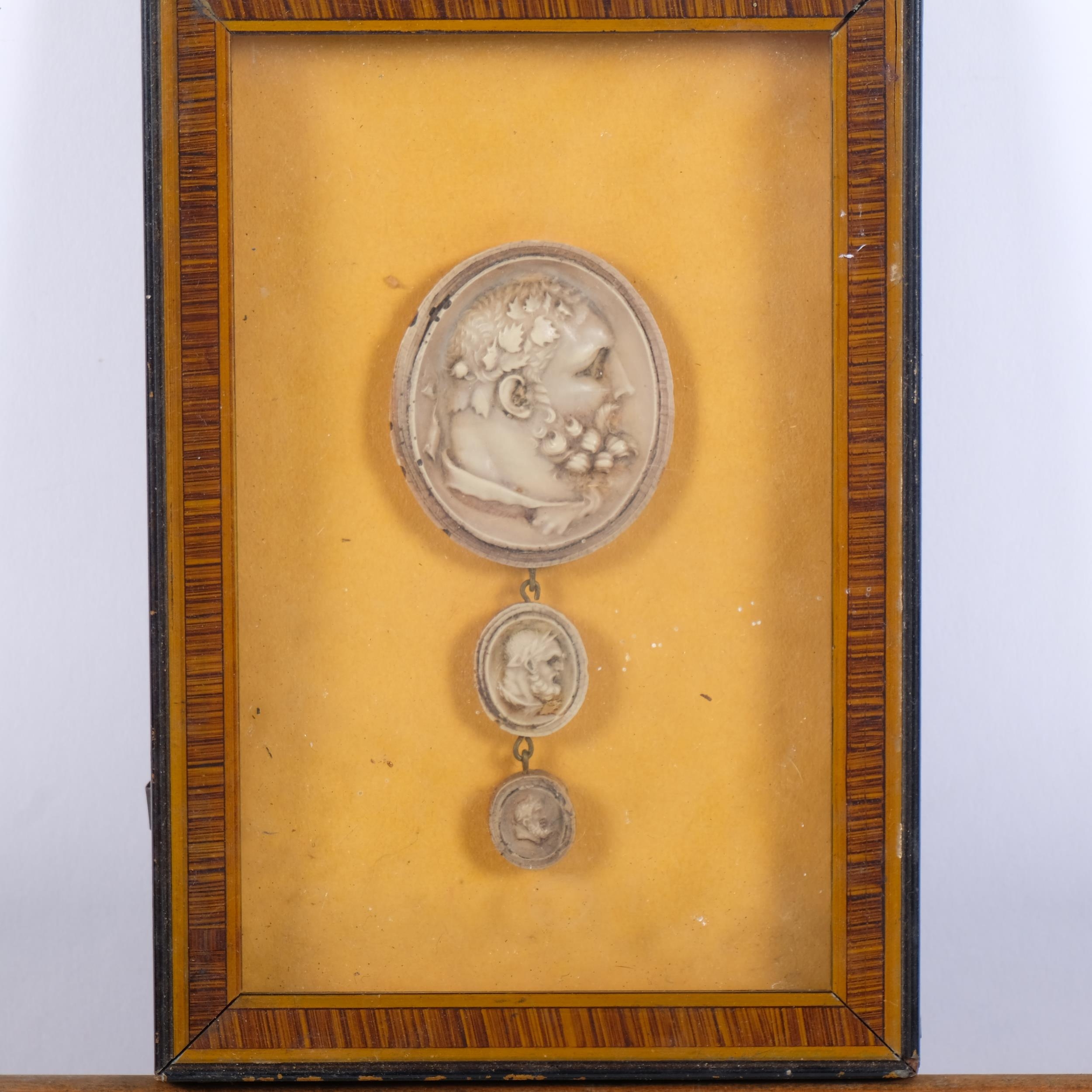 A cased set of 6 Grand Tour style intaglios, and another smaller cased ...