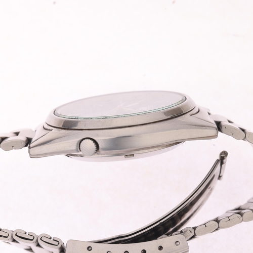 1027 - SEIKO 5 - a stainless steel automatic calendar bracelet watch, ref. 7009-3040, blue dial with baton ... 