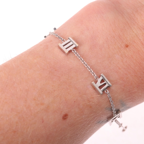 1104 - TIFFANY & CO - an 18ct white gold Atlas Collection chain bracelet, with Roman numeral stations, sign... 