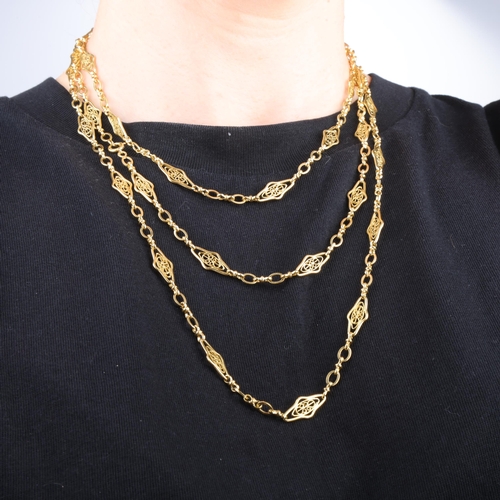 1119 - An Antique French 18ct gold fancy link long guard chain necklace, maker FL, with balance scales, sha... 