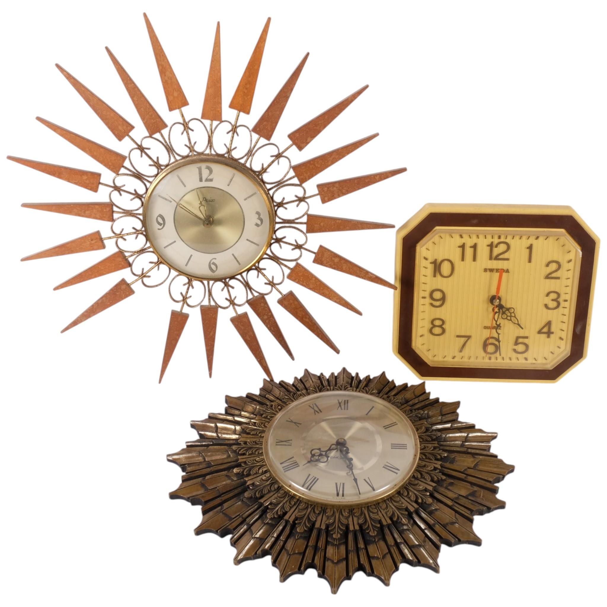 A Seth Thomas giltwood sunburst wall clock, a Paico sunburst clock, and ...