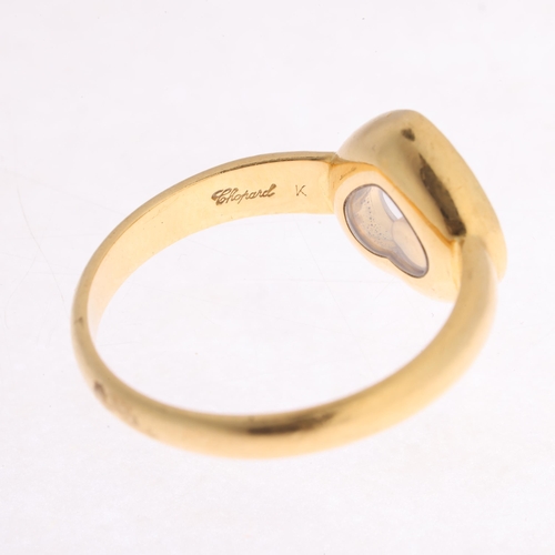 110 - CHOPARD - an 18ct gold 'Happy Diamonds' ring, the heart panel glazed and revealing a 'Floating' diam... 