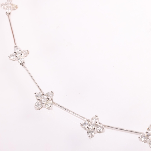 135 - An 18ct white gold diamond collar necklace, maker RG, the cruciform motifs claw set with graduated m... 