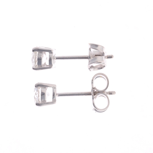 304 - A pair of 18ct white gold 0.80ct single stone diamond stud earrings, each claw set with 0.40ct moder... 