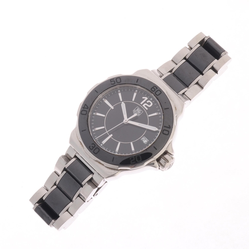 32 - TAG HEUER - a lady's stainless steel and black ceramic Formula 1 quartz calendar bracelet watch, ref... 