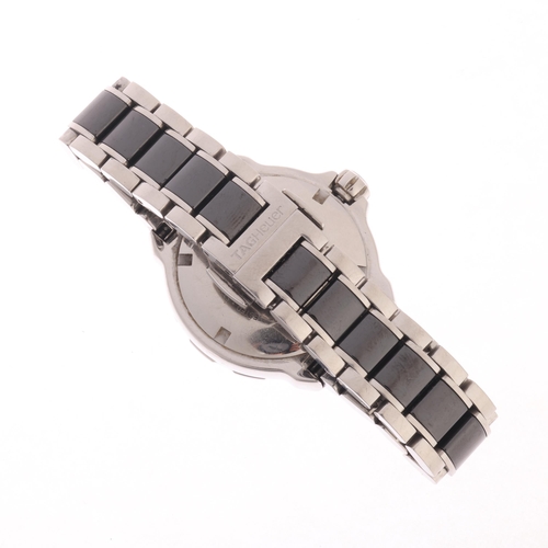 32 - TAG HEUER - a lady's stainless steel and black ceramic Formula 1 quartz calendar bracelet watch, ref... 