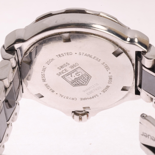 32 - TAG HEUER - a lady's stainless steel and black ceramic Formula 1 quartz calendar bracelet watch, ref... 