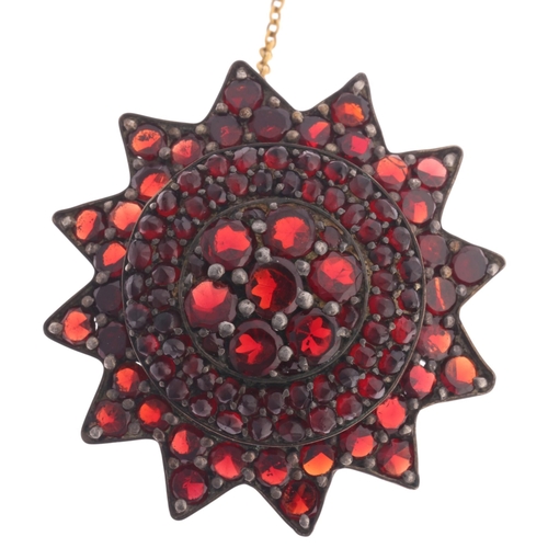 345 - An Antique Victorian Bohemian garnet flowerhead brooch, set with round flat top and rose-cut garnets... 