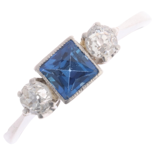 361 - A platinum three stone sapphire and diamond ring, millegrain set with 0.20ct square scissor-cut sapp... 