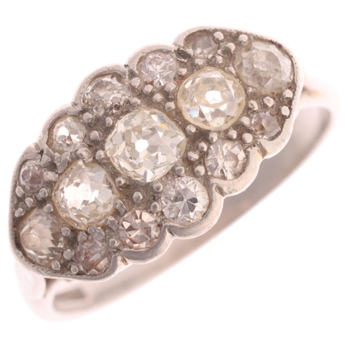 369 - An Antique platinum diamond boat cluster ring, millegrain set with old-cut diamonds, total diamond c... 