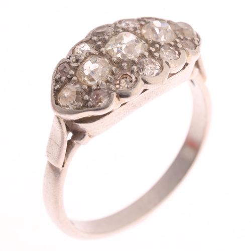 369 - An Antique platinum diamond boat cluster ring, millegrain set with old-cut diamonds, total diamond c... 
