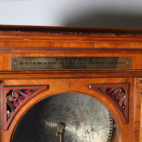 12 - A 19th century Swiss polyphon, penny operated mechanism in floor standing walnut cabinet, Leipzig ma... 