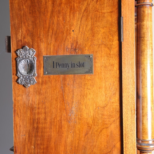 12 - A 19th century Swiss polyphon, penny operated mechanism in floor standing walnut cabinet, Leipzig ma... 