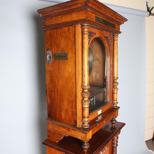 12 - A 19th century Swiss polyphon, penny operated mechanism in floor standing walnut cabinet, Leipzig ma... 