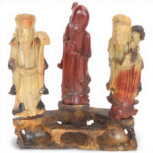 201 - A set of 3 Chinese carved soapstone sage figures, on stand, overall height 25cm
