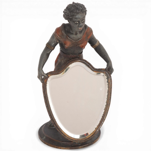 228 - A cold painted metal figure holding a mirror, height 23cm