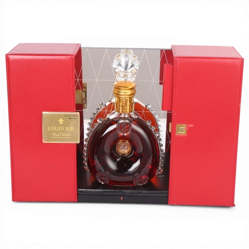62 - A Remy Martin Louis XIII Grande Champagne Cognac bottle in gift box, with mirror back display case. ... 