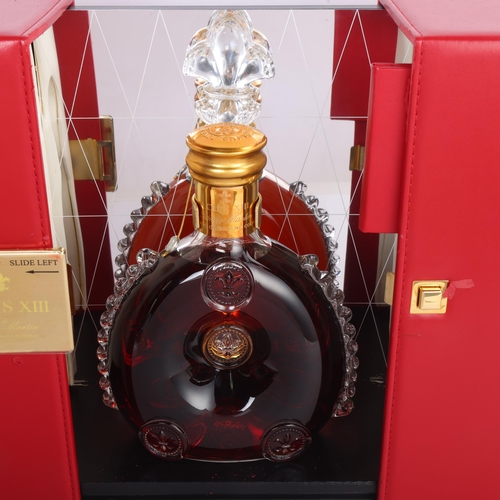 62 - A Remy Martin Louis XIII Grande Champagne Cognac bottle in gift box, with mirror back display case. ... 