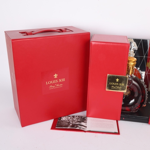 62 - A Remy Martin Louis XIII Grande Champagne Cognac bottle in gift box, with mirror back display case. ... 