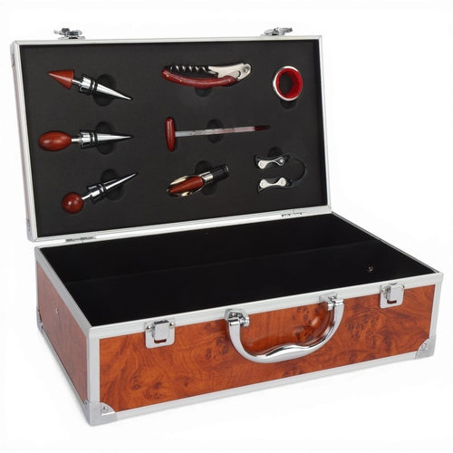 76 - An 8 piece wine accessory set, stainless steel with hardwood handles, in aluminium and faux burr woo... 