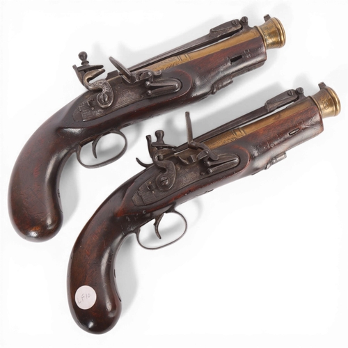 78 - A pair of early 19th century brass barrel flintlock blunderbuss pistols, with sprung bayonets, engra... 